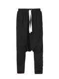 Long Drop Crotch Trousers 
Details :
Black cotton drop crotch trousers 
drawstring-waist 
drop crotch
side pockets 
elastic waistband can easily fit in between sizes 
Composition
 Cotton 96 PantsAlchemy The LabelAlchemy The LabelLong Drop Crotch Trousers